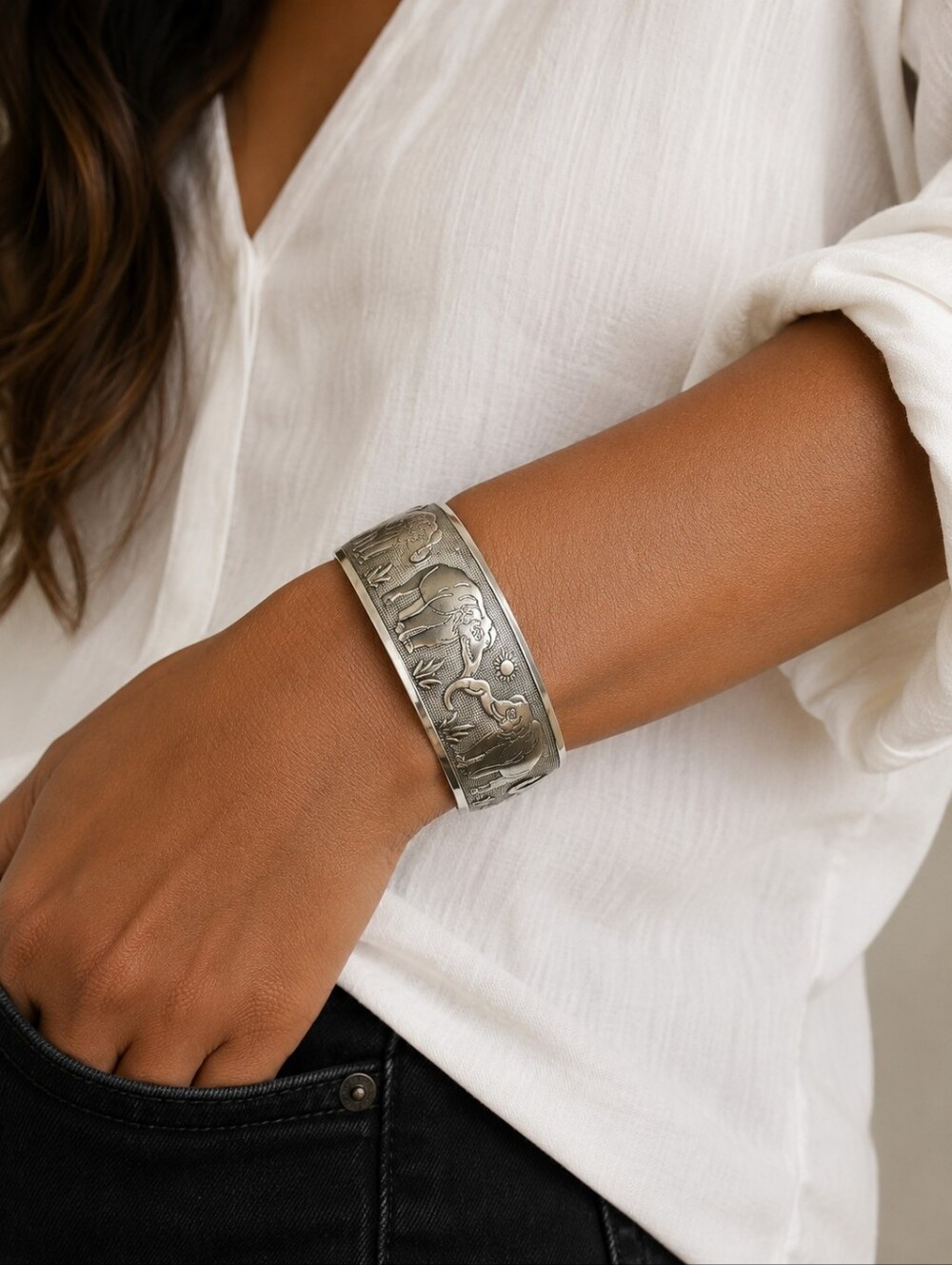 Silver tone cuff elephant bangle.